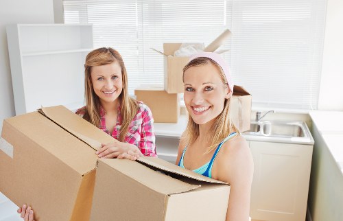 Professional movers handling furniture